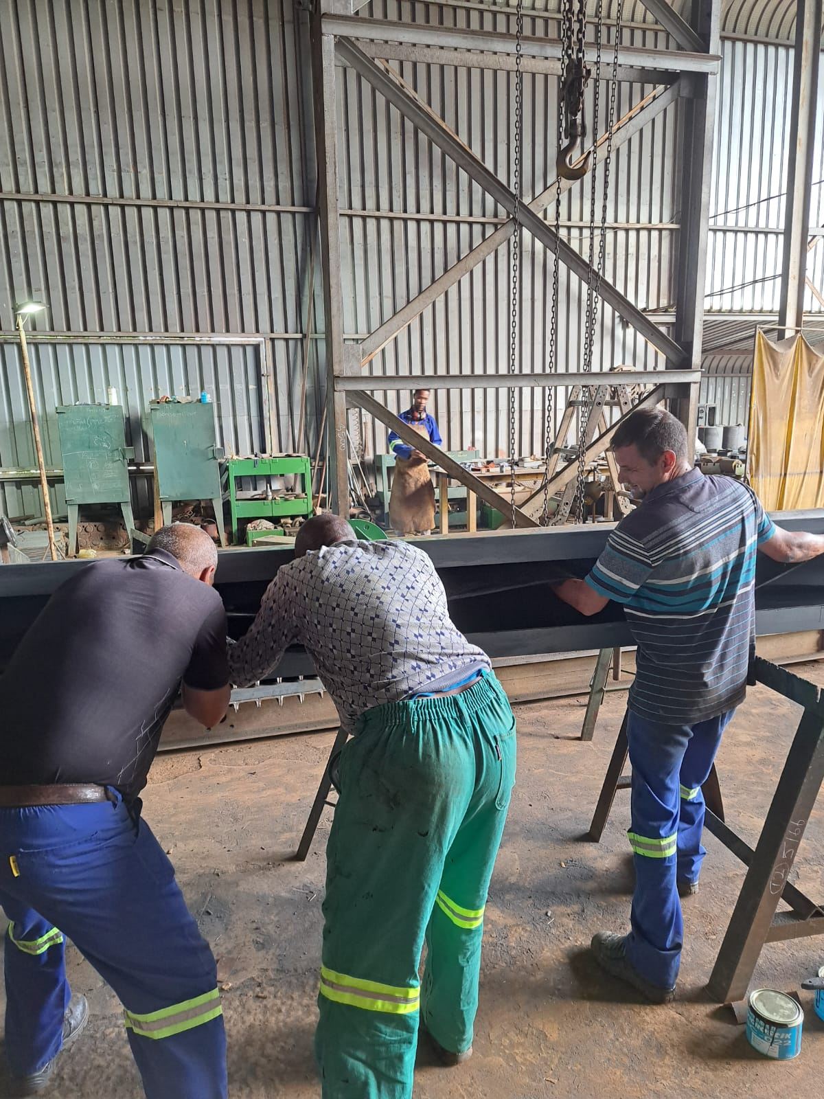 Team rubber-lining launders in the workshop